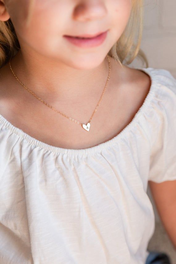 A super cute flower girl heart pendant initial necklace.  This adorable initial necklace makes the perfect personalized gift for any girl, any age!  You'll love the look of excitement in their eye as they open their very own custom heart initial necklace!  A perfect "thank you" for them being a part of your special day.It's simple, classic design will be popular and trendy for many years to come.  Each matte gold or silver initial heart charm is strung from a sturdy diamond-cut chain.  Strong en Necklace For Toddler Girl, Cute Personalized Heart Necklaces, Personalized Heart-shaped Cute Necklace, Cute Adjustable Necklace With Heart Charm, Cute Adjustable Heart Charm Necklace, Cute Personalized Heart Necklace For Mother's Day, Cute Heart Pendant Charm Necklace For Mother's Day, Cute Heart Pendant Charm Necklaces For Mother's Day, Cute Heart Necklace For Mother's Day Gift