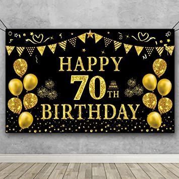 a black and gold birthday banner hanging on a wall