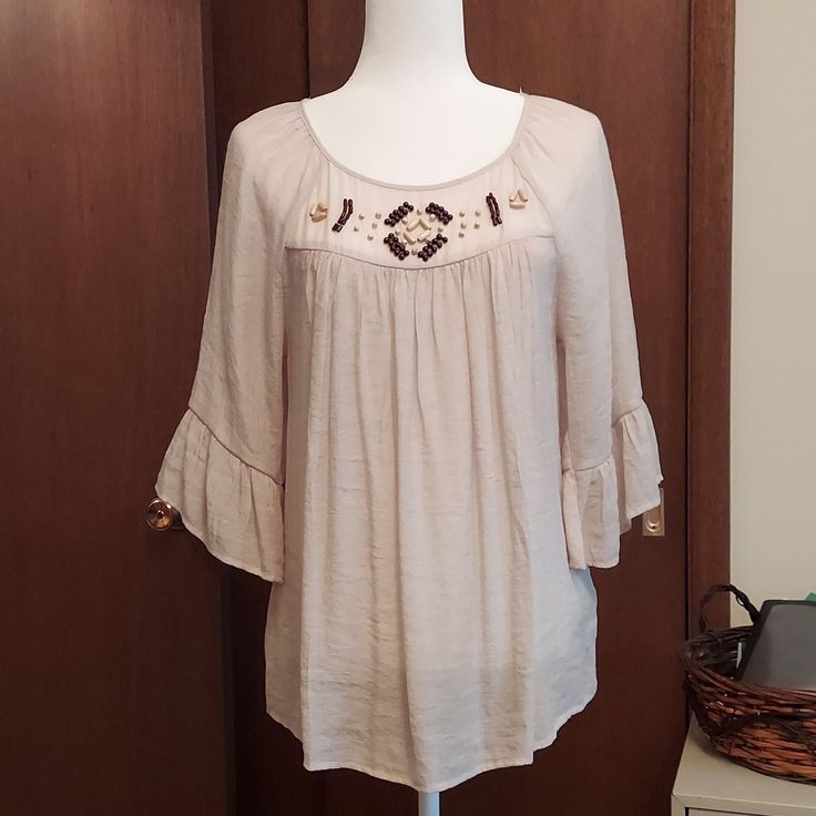 Light And Airy Semi Sheer, Beige Color. Bead Decoration Around Neckline. Flowy Sleeves. Excellent Condition. Nwot...I Bought It And Never Wore. Bohemian Beaded Tops For Beach, Summer Embellished Beige Blouse, Beaded Tops For Spring Vacation, Casual Beaded Tops For The Beach, Casual Beaded Tops For Beach, Beaded Tops For Vacation In Spring, Spring Vacation Beaded Tops, Beige Embellished Blouse, Embellished Cream Top For Summer