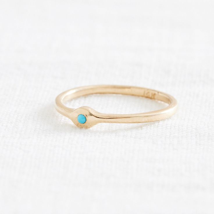 A little blip of color to brighten up your look. This charming little Sleeping Beauty Turquoise is set into a minimal 14k setting. Sleeping Beauty Turquoise is prized for it's even, consistent color and sky-blue hue, and this stone is no exception- the simplicity of the setting allows the bright stone to shine. Comfortable, unique, and feminine: what's not to love? Materials: 14k, 1.6mm Ethically Sourced Sleeping Beauty Turquoise Size: 7.75 ready to ship, can be resized. Allow up to 10 days for Turquoise 14k Gold Jewelry With Bezel Setting, Minimalist Turquoise Ring For Everyday, Turquoise Minimalist Jewelry For Anniversary, Minimalist Turquoise Jewelry For Anniversary, Everyday Turquoise 14k Gold Jewelry, Everyday 14k Gold Turquoise Jewelry, Minimalist Everyday Turquoise Rings, Turquoise Birthstone Ring Fine Jewelry, Turquoise Birthstone Ring In Fine Jewelry Style