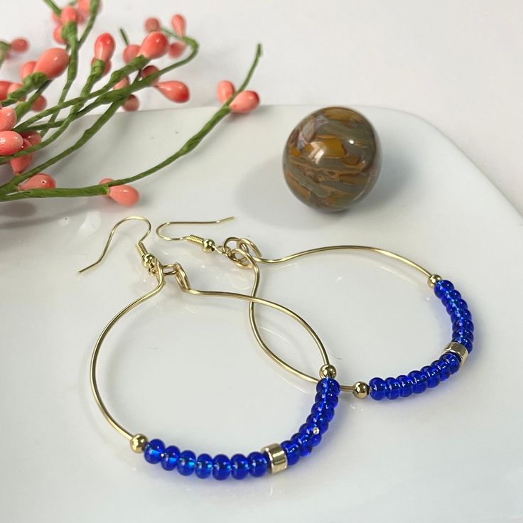 Blue Beaded 14k Gold-filled Jewelry, Adjustable Gold Hoop Earrings With Faceted Beads, Blue Beaded Jewelry In 14k Gold Filled, Beaded 14k Gold Filled Hoop Earrings, Gold Round Beaded Earrings With Faceted Beads, Gold Round Faceted Beads Earrings, Gold Hoop Earrings With Round Beads, Beaded 14k Gold Filled Round Earrings, Blue Wire Wrapped Hoop Beaded Earrings