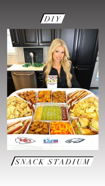 a woman is standing in front of a football stadium food tray with snacks on it