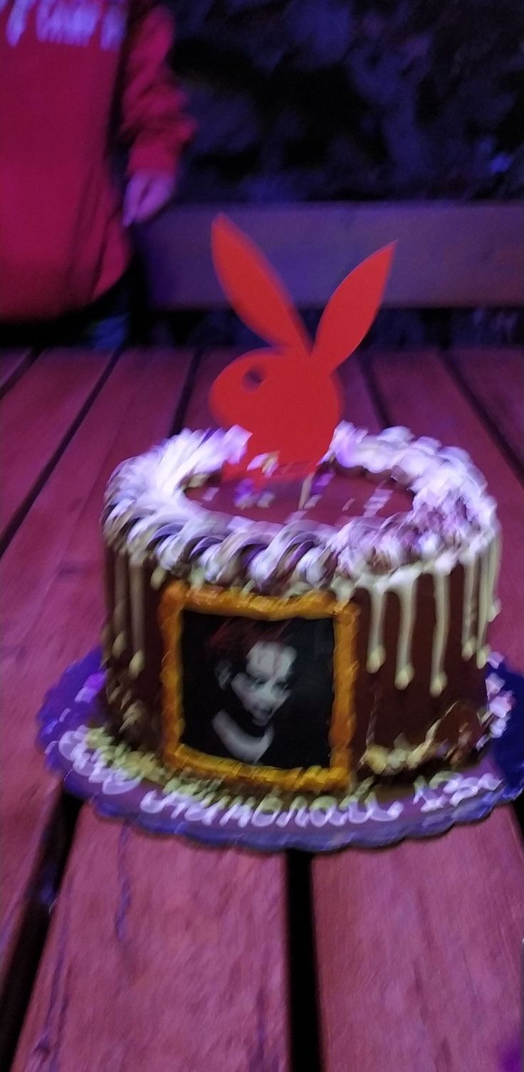 a cake sitting on top of a wooden table