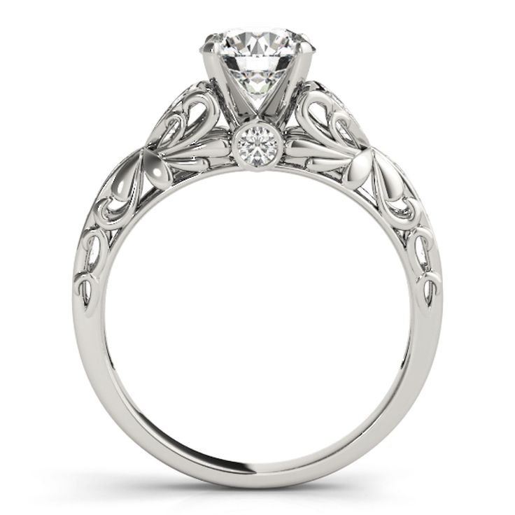 a white gold engagement ring with an intricate design