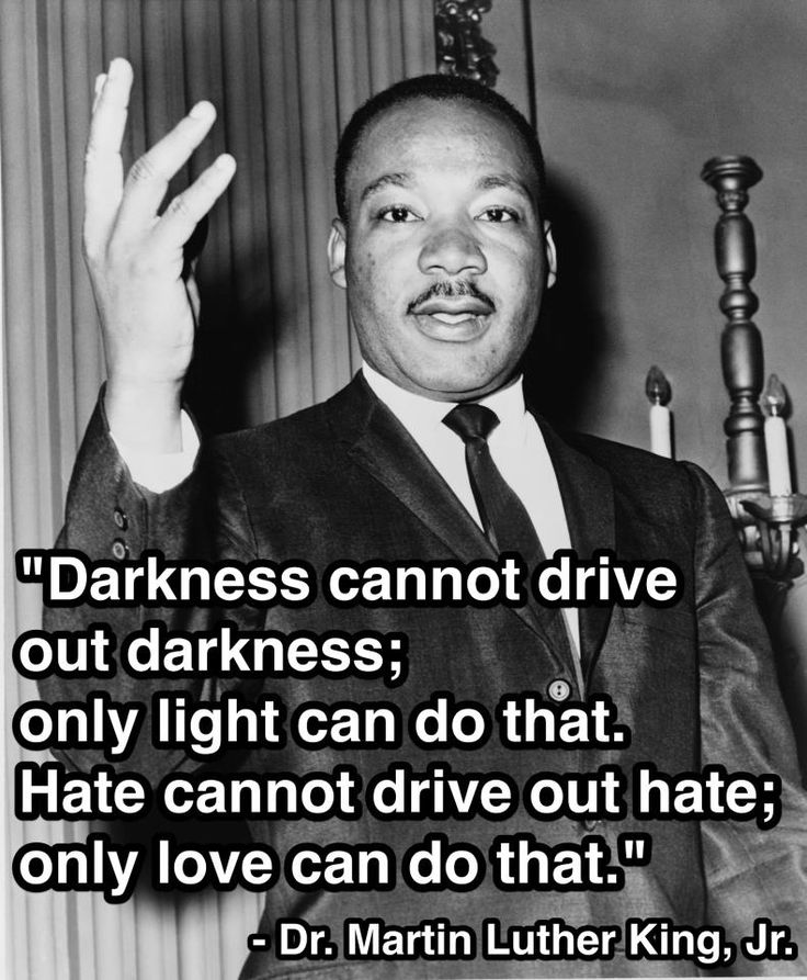 martin luther king holding his hand up in the air and saying darkness cannot drive out darkness, only light can do that hate cannot