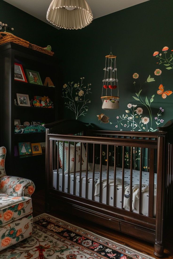 a baby's room with green walls and floral wallpaper, including a crib