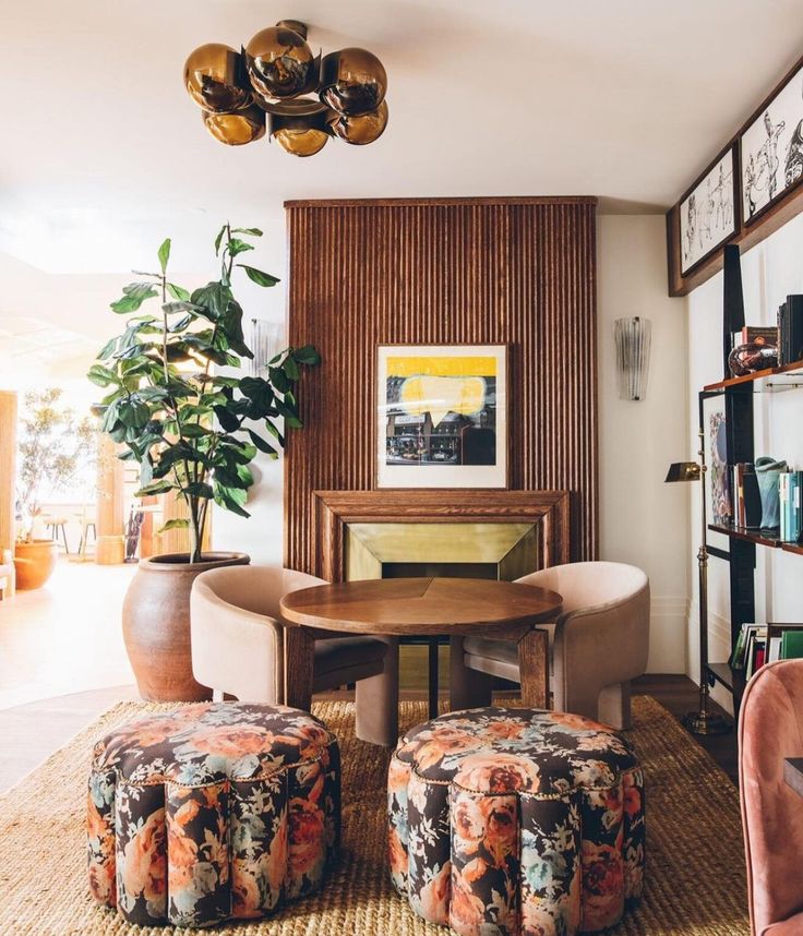 a living room with chairs and a table in it