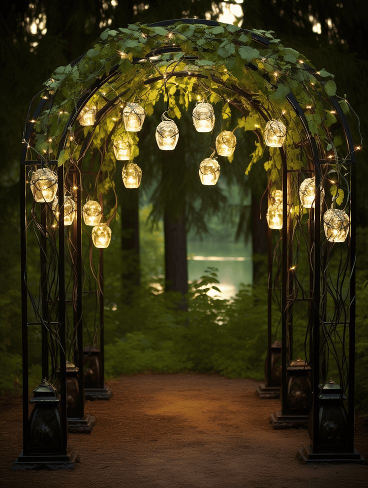 an archway with lanterns hanging from it's sides in the middle of a park