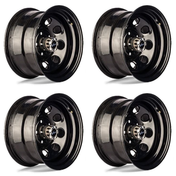 four black wheels with chrome spokes on white background