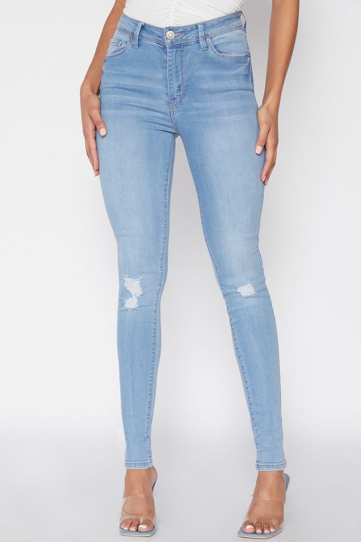 Maximize your style with our Women's Essential High Rise Skinny Ankle Jean! From their classic five pocket construction and single-button closure to their curve-hugging fit, these high-waisted denim jeans are sure to be your new favorite go-to. Style with a cropped top and tennies for a casual, sporty vibe, or with a tucked tank and heels for something sexier. Show 'em what you’re workin' with and look good doin' it! Product Details- High-Rise- Zip Fly with Single Button Closure - Belt Loops- 5-Pocket Construction- Fitted Throughout Measurement (Based on size 5)- Inseam: 30”- Rise (To top edge of band): 10”- Leg Opening: 9.5”- Model is wearing size 3 Machine wash cold. 73% Cotton/ 25% Polyester/ 2% Spandex (Colors: M08, M1862, C1862, S1862, W37, C08 and S08) Light Wash Cropped Leg Bottoms With Button Closure, Cropped Leg Light Wash Bottoms With Button Closure, High Rise Stretch Jeggings With Button Closure, Fitted Denim Blue Bottoms With Button Closure, Stretch High Rise Jeggings With Button Closure, Mid-rise Slim Fit Bottoms With Button Closure, Slim Fit Mid-rise Bottoms With Button Closure, Fitted Medium Wash Pants With Button Closure, Spring Mid-rise Bottoms