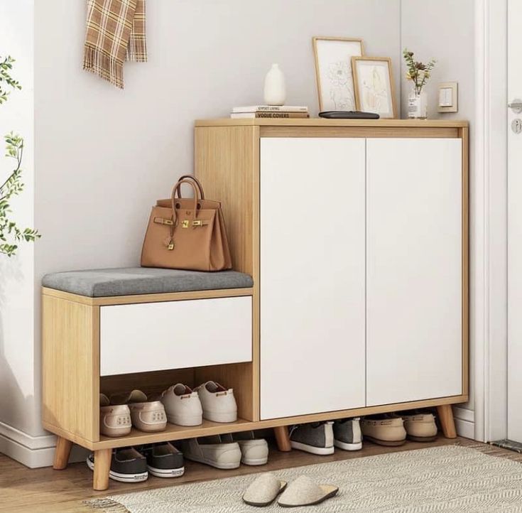 a shoe rack with shoes on it next to a door and a rug in front of it