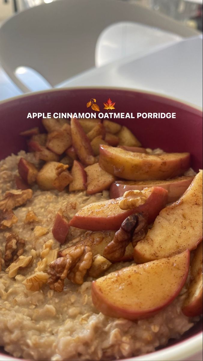 apple cinnamon oatmeal porridge in a red bowl