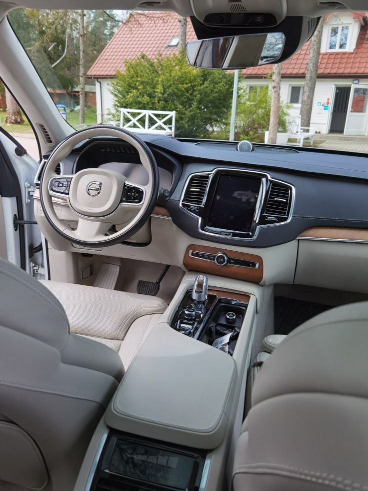 the interior of a car with dashboard, steering wheel and center console in front of it