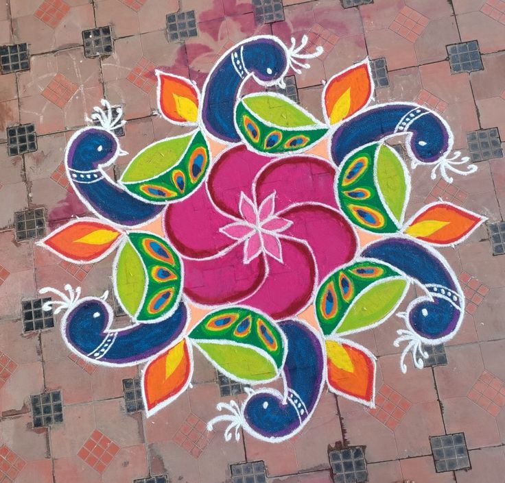 a colorful flower design painted on the ground