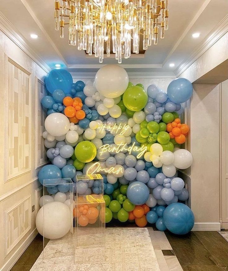 balloons and streamers are on the wall in this hallway for a birthday party or celebration