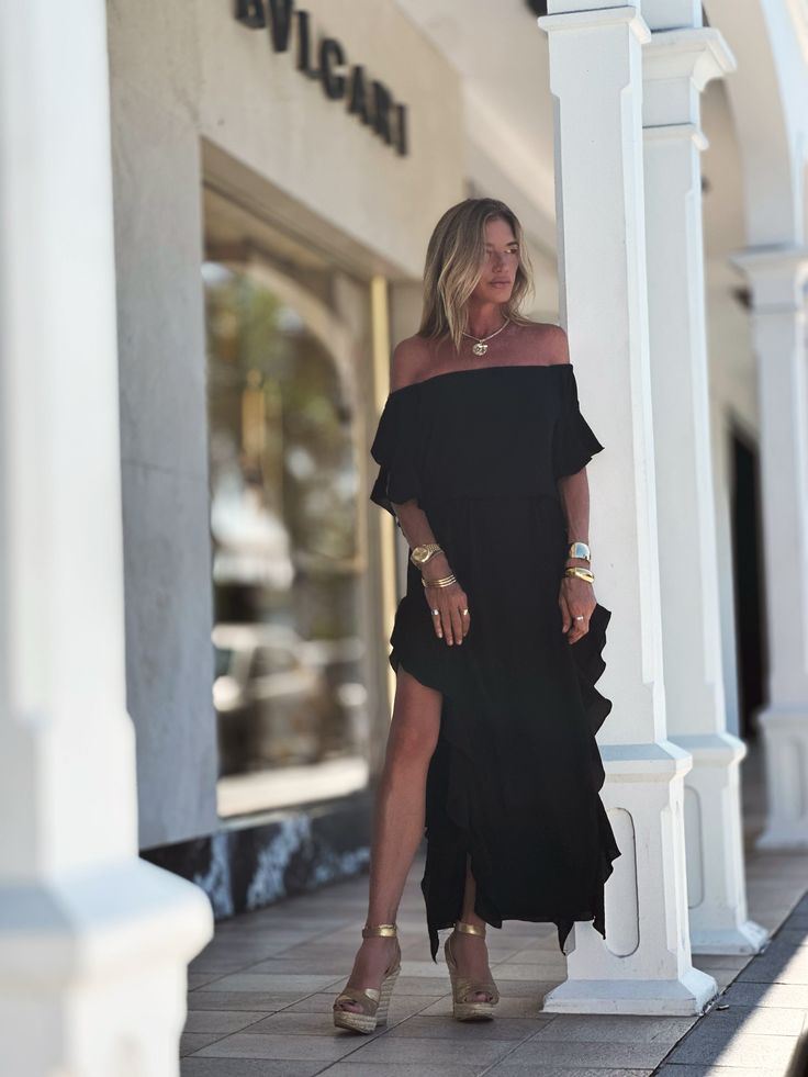 Indulge in the chic style of the Lucy Dress, featuring an off-the-shoulder design, delicate ruffled sleeves, and side seams with romantic ruffles. Modern side openings and a flowing maxi length complete the look. The double-layered body and single layered sleeves create a tantalizing contrast. Elevate your ensemble by pairing it with our Signature belts Elastic on Sleeve 100% Chiffon Lining 100% Chiffon Dry clean or Hand Wash or Delicate Cycle Wash and Hang Dry Designed with love in Miami, FL US Layered Sleeves, Long Dress Black, Black And White Flowers, Mini Dress Casual, Ruffled Sleeves, Kaftan Dress, Shoulder Design, Miami Fl, The Chic