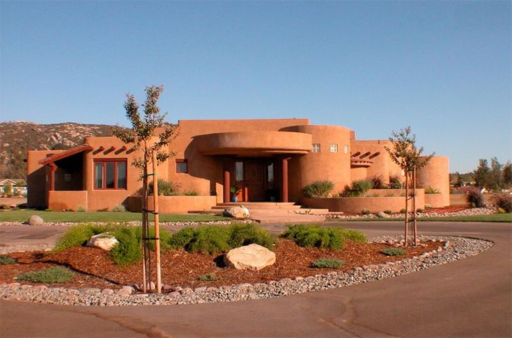 an adobe - style house in the middle of a desert