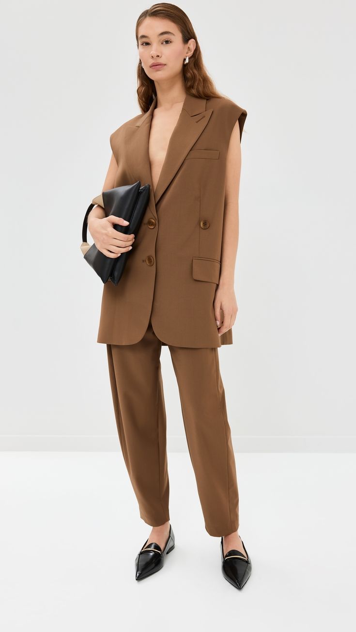 Find TIBI Tropical Wool Liam Vest on Editorialist. Fabric: Mid-weight, low-stretch suiting. Peaked lapels. Collared neck. Sleeveless. Button placket. Welt breast and flap hip pockets. Shell: 53% polyester/43% wool/4% elastane. Lining: 60% cupro/40% cotton. Dry clean. Imported, China. Measurements: Measurements from size XS Length: 31.5in / 80.0cm, from shoulder Toffee, Button Placket, Top Brands, New Arrivals, Jackets & Coats, Dry Clean, Trousers, Luxury Fashion, Wool