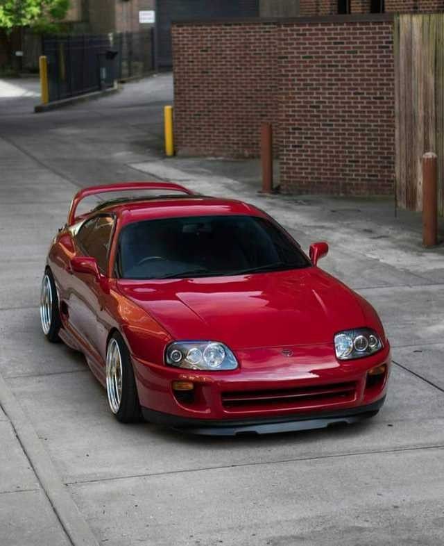 a red sports car parked on the street