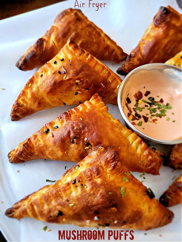 some food is on a white plate with dipping sauce