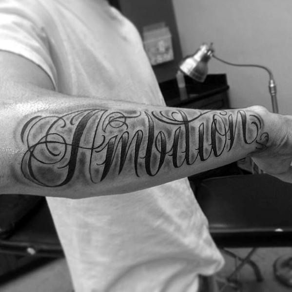 a man with a tattoo on his arm that says annotation in cursive writing