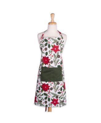 an apron on a mannequin with poinsettis and holly leaves printed