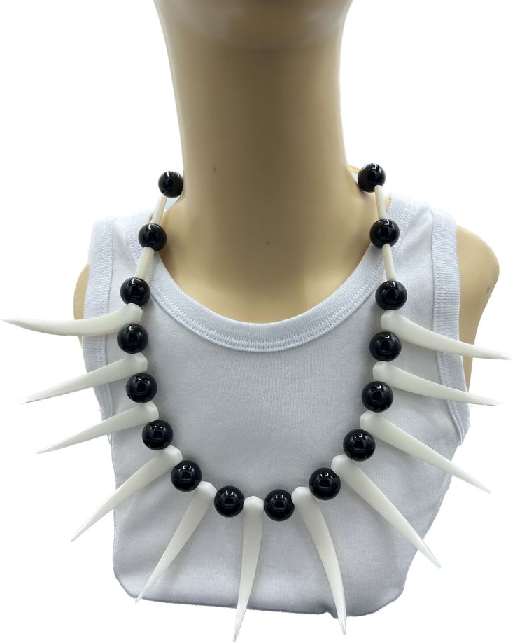 Embrace the rich heritage of Samoa with our striking Plastic Samoan Ula Nifo in Black. This traditional necklace, crafted from durable plastic, features the iconic tooth-like design that symbolizes strength and courage in Samoan culture. The sleek black finish adds a touch of modern elegance, making it a versatile accessory for both traditional ceremonies and contemporary outfits. Lightweight and comfortable to wear, the Ula Nifo is perfect for showcasing your cultural pride or adding a unique s Black Plastic Jewelry Gift, Handmade Black Plastic Jewelry, Samoan Culture, Traditional Necklace, Traditional Dance, Stylish Necklace, Contemporary Outfits, Samoa, Modern Elegance