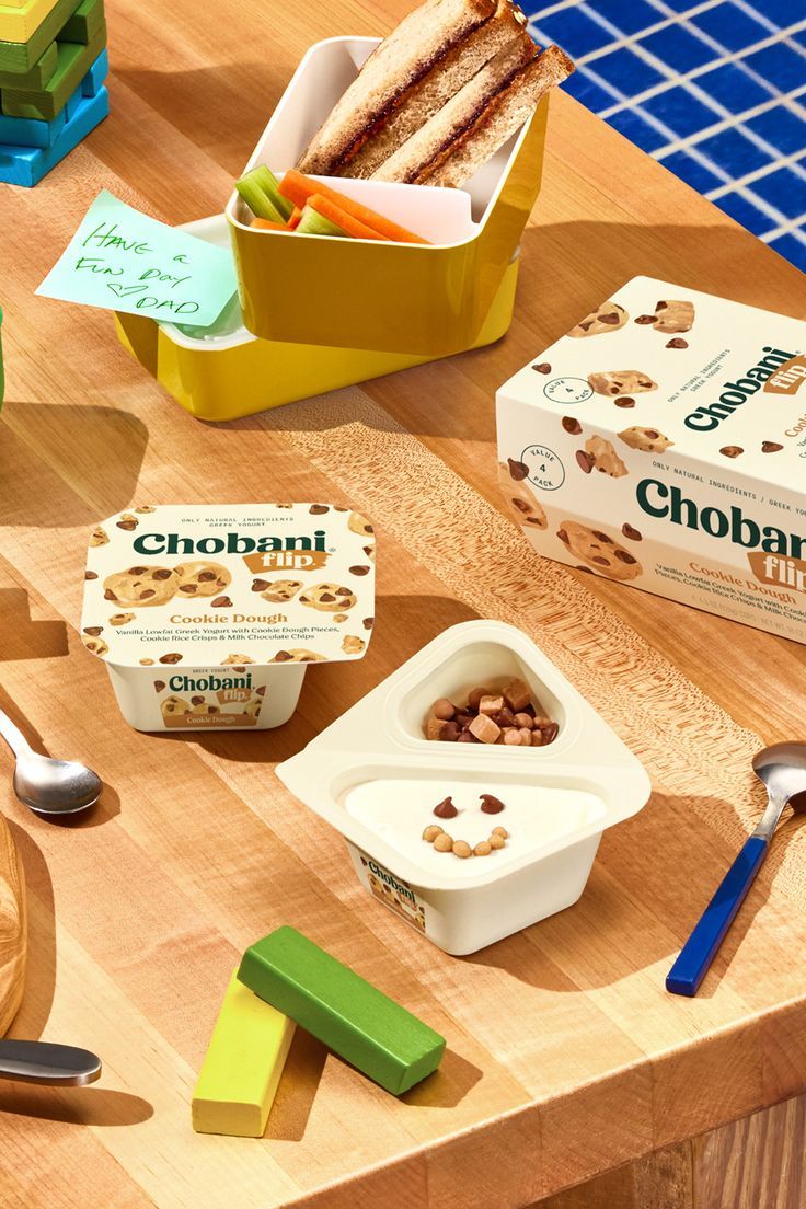 an assortment of food items on a wooden table