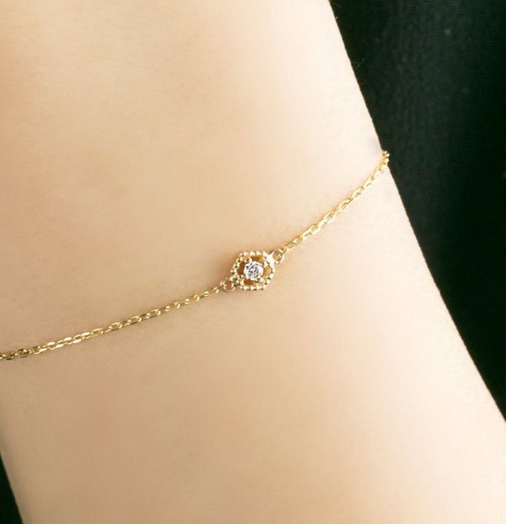 "Simple and delicate hexagon bracelet features fine cut round brilliant gemstone. Bracelet shimmers and will add great sparkle to complete your look. Perfect for everyday, also would make great layering style. A lightweight yet very sturdy piece with your choice of 14k gold. Express your love with this sweet gift for your special partner or friends. * Hexagon size: ≈5mm * Gemstone options: ≈2mm ≈0.03ct white diamond * 14k diamond cut chain length: 6~7\" adjustable by default :: Custom length ava Elegant Hexagon-shaped Yellow Gold Jewelry, Delicate Diamond Jubilee Bracelet, Dainty Diamond White Bracelets For Formal Occasions, Dainty Diamond White Bracelets With Diamond Accents, Dainty Cubic Zirconia Diamond Cut Bracelet, Dainty White Gold Bracelet With Diamond Accents, 14k White Gold Chain Bracelet With Diamond, Elegant Hexagon Diamond Cut Jewelry, Dainty Diamond White Bracelet With Diamond Accents