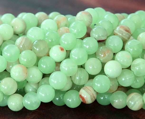 some green beads are sitting on a table