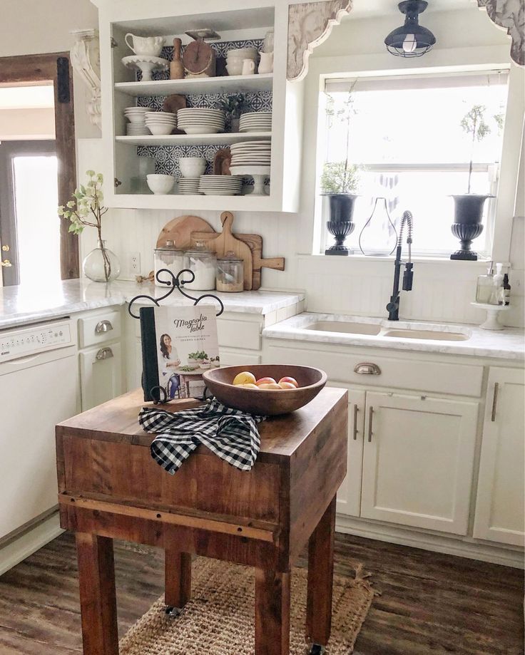 a wooden table topped with a bowl of fruit on top of a hard wood floor