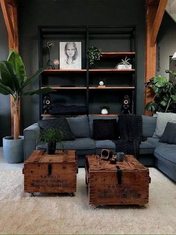 a living room filled with furniture and lots of wood boxes on top of it's coffee table