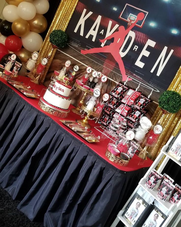 a red and white table topped with cakes and desserts