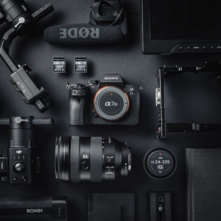 many different types of cameras and accessories laid out on a black surface with the words rode above them