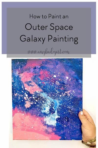 someone holding up a painting with the words how to paint an outer space galaxy painting on it