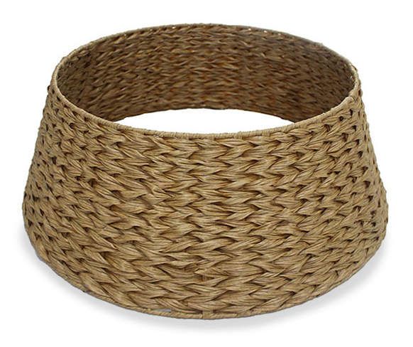 a large round basket is shown on a white background, with the bottom section partially covered in wicker