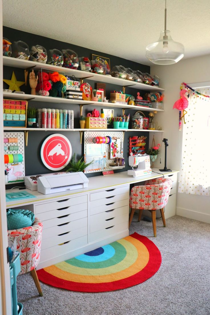 a room filled with lots of colorful furniture and decor on top of bookshelves