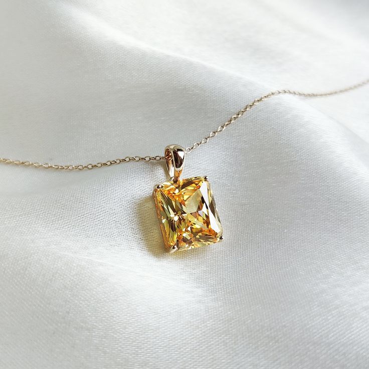 This stunning pendant is set in 14K Solid Yellow Gold with Cubic Zirconia in classic prong setting. It is an unique gemstone pendant for nearly every occasion and is completely hassle-free jewelry. ◾ITEM DETAILS * Gem: Cubic Zirconia * Gem Size: 10X12mm * Gem Shape: Octagon cut * Gem Weight: 10.15 carats * Gold Purity: 14KT  * Gold Weight: 0.98gram * Total Weight of the Pendant: 3.01 gram The Gold purity is guaranteed and it comes with authentic 14KT gold hallmark. Since my items are handmade, t Luxury Kunzite Yellow Gold Jewelry, Gold Baguette Cut Solitaire Necklace, Luxury Baguette Cut Solitaire Necklace As Gift, Gold Jewelry With Baguette Cut Birthstone, Fine Jewelry Solitaire Baguette Cut Necklace Gift, Yellow Gold Baguette Cut Solitaire Necklace, Luxury Gold Solitaire Gemstone Necklace, Classic Gold Topaz Jewelry, Radiant Cut Diamond Jewelry With Birthstone