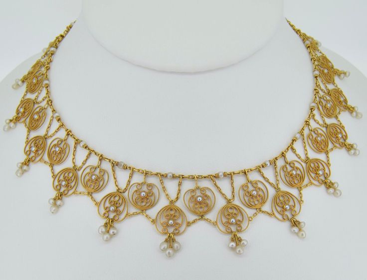 OHHHHH this necklace is so very special. I believe it to be of French origin (however not hallmarked), dating from the 1870s+/-. This necklace is presented in excellent condition. It is crafted from 18K solid yellow gold. The necklace is a full collar necklace, going around the entire neck. It features two tiers all connected to one another with chains to allow for a fabulous natural lay on the neck. The chains are oblong oval gold links. The top is adorned with drilled seed pearls (roughly 2 mm Antique Pendant Jewelry For Opera, Antique Gold Jewelry For Opera, Victorian Pearl Necklace For Formal Occasions, Victorian Hallmarked Jewelry For Opera, Victorian Style Formal Pearl Necklace, Antique Pearl Necklace For Formal Occasions, Baroque Jewelry With Historical Design For Formal Occasions, Ornate Historical Design Necklaces For Formal Occasions, Ornate Historical Design Necklace For Formal Occasions