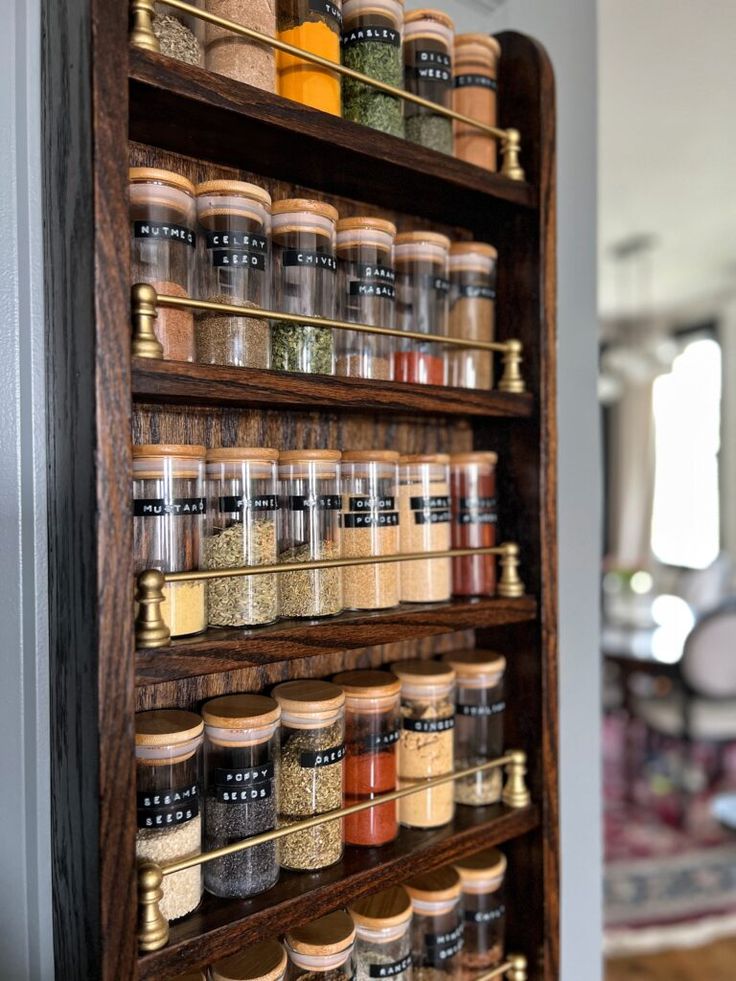 a spice rack filled with lots of different types of spices