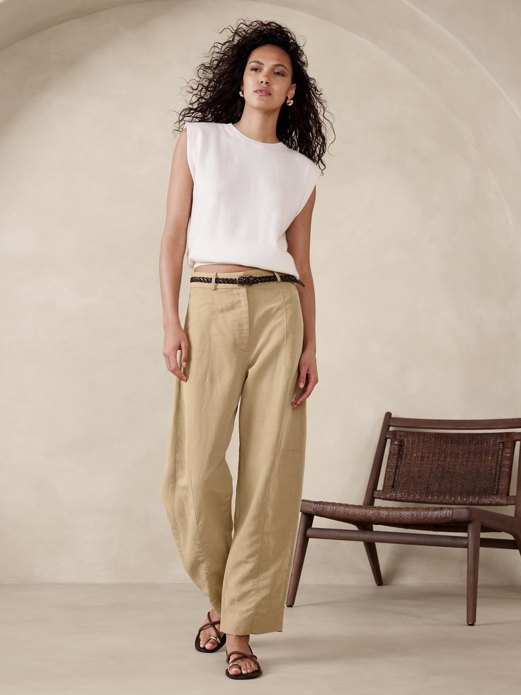 We took a fresh approach to the season's barrel-leg silhouette, achieving an architectural effect with special seams at the knee and hem to create that slightly bowed silhouette through the leg.  Here, we cut this pant in a beautifully breathable blend of TENCEL™ lyocell and luxurious linen--a fabric we love for its silky drape and its ability to stay fresh even in heat and humidity.  Barrel Leg: High rise (11") with a relaxed, barrel leg.  Ankle length Sustainability: Made with TENCEL™ lyocell, a sustainably sourced fiber from responsibly-harvested trees.  Zip fly with hook-and-bar closure.  Removable slider belt.  Front and back pockets.  Unlined.  Barrel Leg: High rise (11") with a relaxed, barrel leg.  Ankle length.  Inseams: Petite/Short 25. 5", Regular 27. 5", Tall 30. 5" Model: Size Linen Pant, Technology Fashion, Petite Shorts, Celebrity Lifestyle, Europe Trip, Twill Pants, Linen Trousers, Luxury Linen, Bottom Clothes