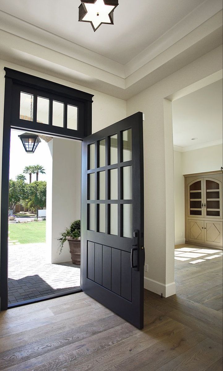 an open door leading into a spacious house