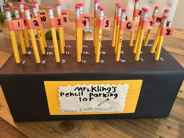 there are many pencils on the table with numbers and letters written on each one