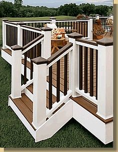 an outdoor deck with wooden steps and railings