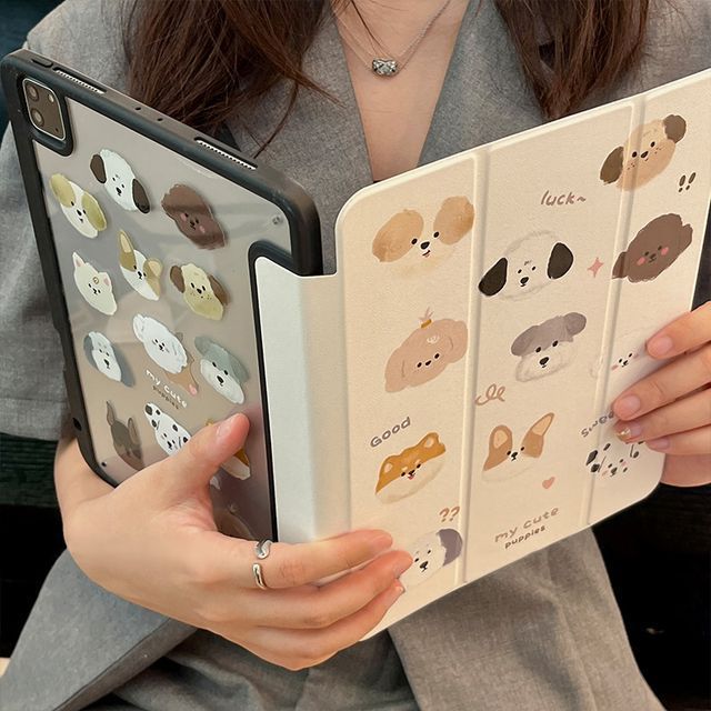 a woman is holding an open book with stickers on it