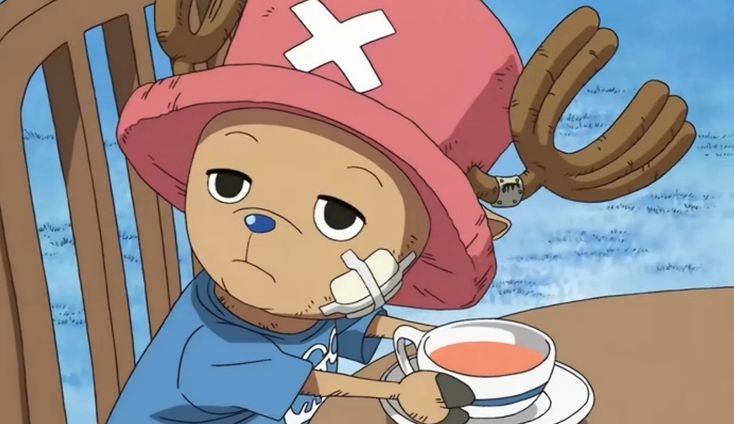 a cartoon character sitting at a table with a cup of tea