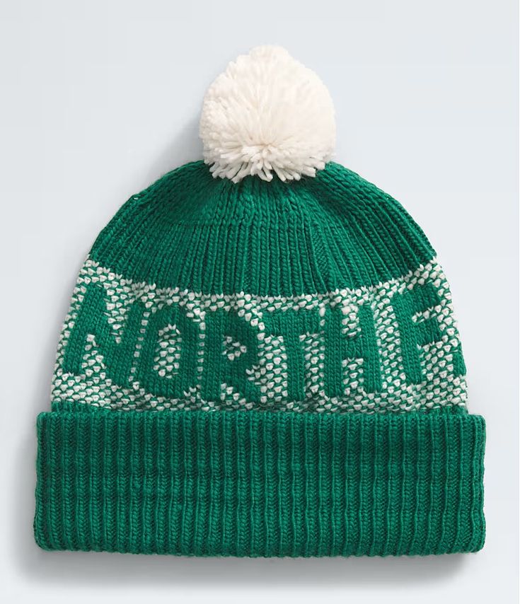 a green hat with white pom - pom on the top and wording