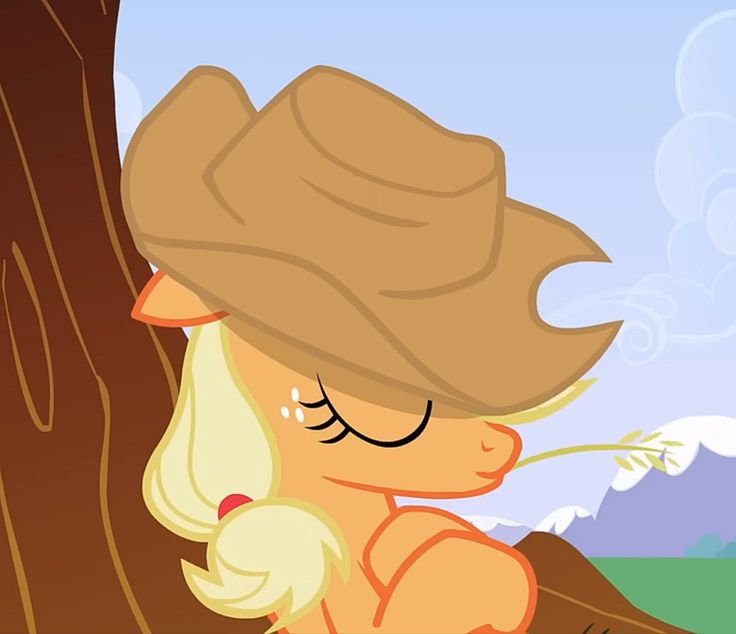 the pony is leaning against a tree with its eyes closed and it's nose covered by a hat