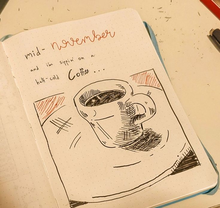 a notebook with a drawing of a cup of coffee