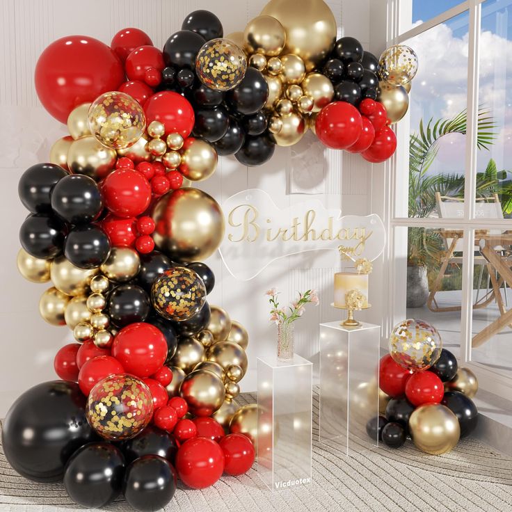 the balloon arch is decorated with black, gold and red balloons for a birthday party